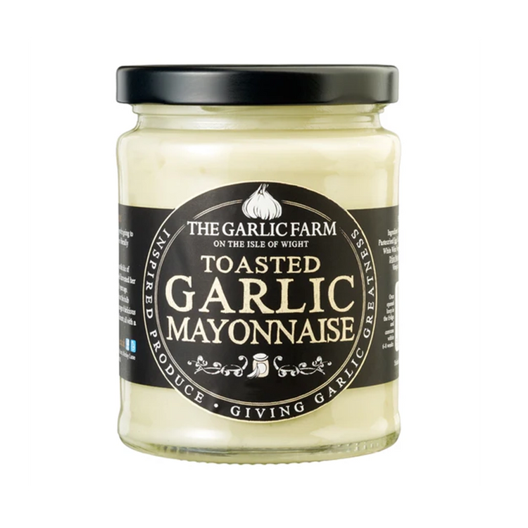 A glass jar with a black label, on the label is the garlic farm logo with the title of toasted garlic mayonnaise in bold.