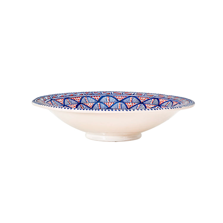 Side angle of an extra large decorative bowl with a vibrant, Moroccan-style, sunburst design