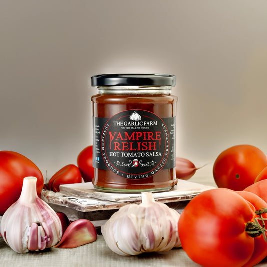 The Garlic Famr Vampire Relish on board with fresh tomatoes and garlic