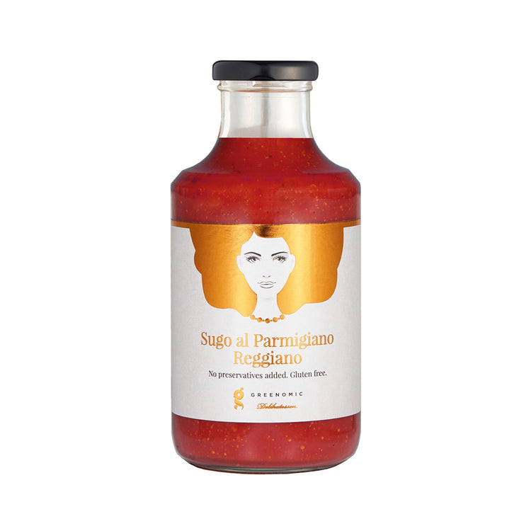 A glass bottle with Good Hair Day Tomato and Parmigiano Reggiano Sauce inside. On the white label there is an image of a women with golden hair and the writing Sugo al Parmigiano Reggiano