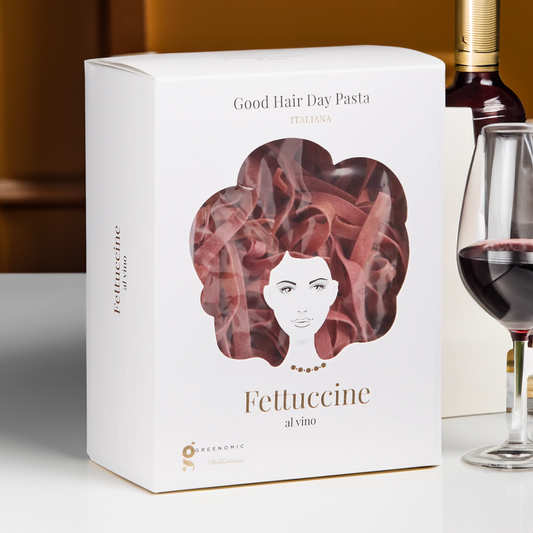 Good Hair Day Pasta Fettuccine al vino on table with red wine glass