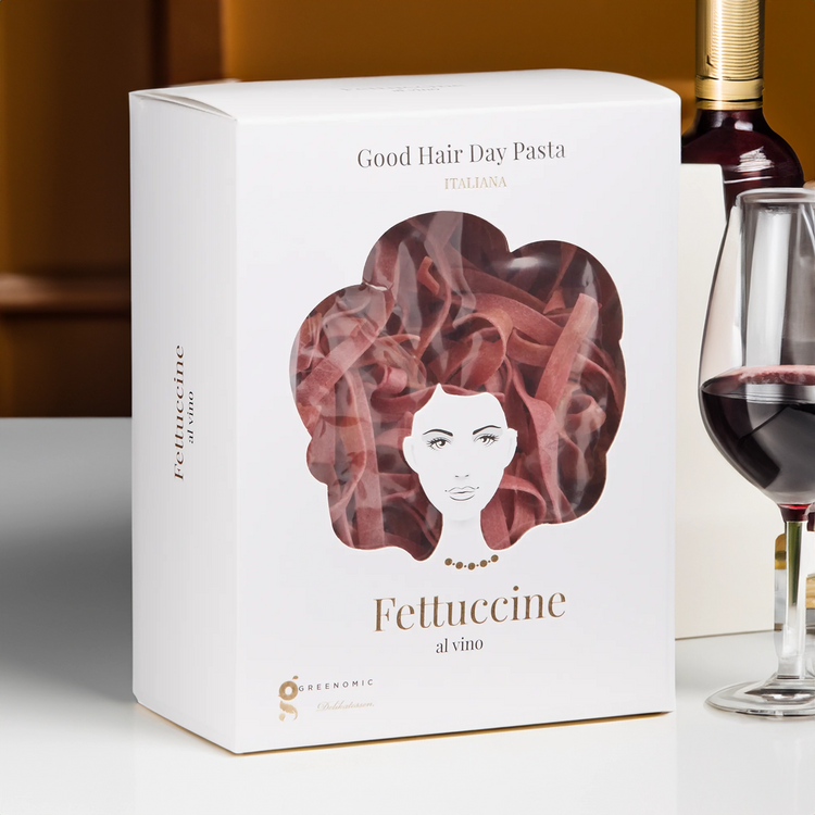 Good Hair Day Pasta Fettuccine al vino on table with red wine glass
