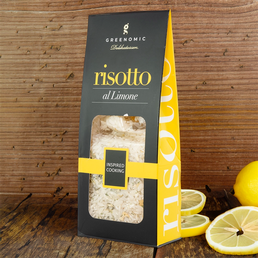 this shows the packet in a lifestyle setting on a wooden table with lemons in the foreground of the image.