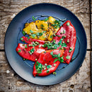 Oregano infused olive oil drizzled over roasted peppers