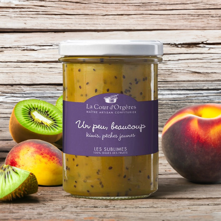 La Cour d'Orgères Kiwi and Peach Jam with fresh fruit on wooden table