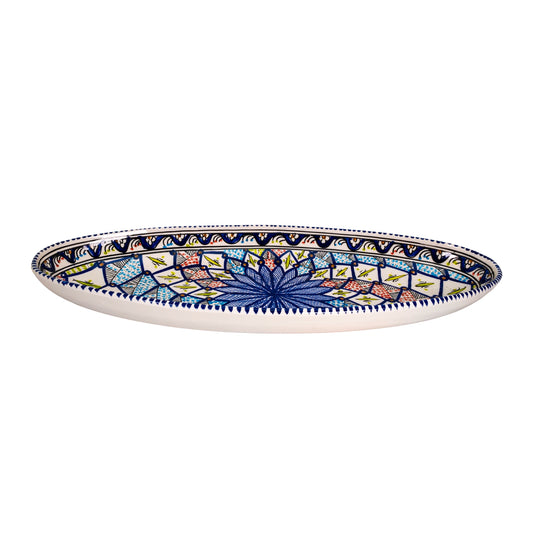 A side view of the oval ceramic dish with a colorful kaleidoscope pattern showing the 6cm depth.