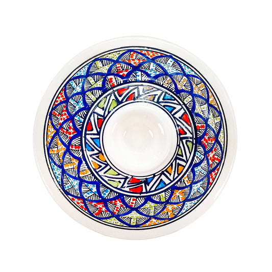 Top view of the lid of Casserole dish consisting of intricate overlapping scales in a repeating pattern