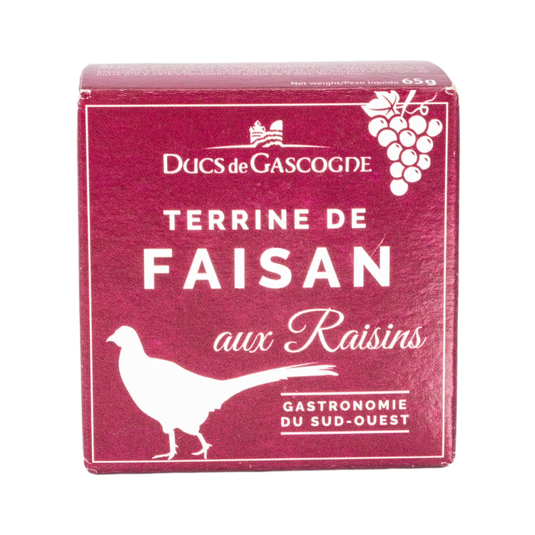 A front view of a small red box with the Duc de Gascogne logo and the title Terrine de faisan aux raisins with the outline of a pheasant in the corner of the box