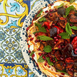 Jorge's chef curated bowl of salad on a colourful background.