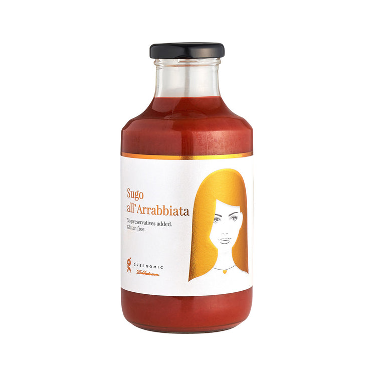 A glass bottle with Good Hair Day Arrabbiata Sauce inside. On the white label there is an image of a women with golden hair and the writing Sugo all' Arrabbiata.