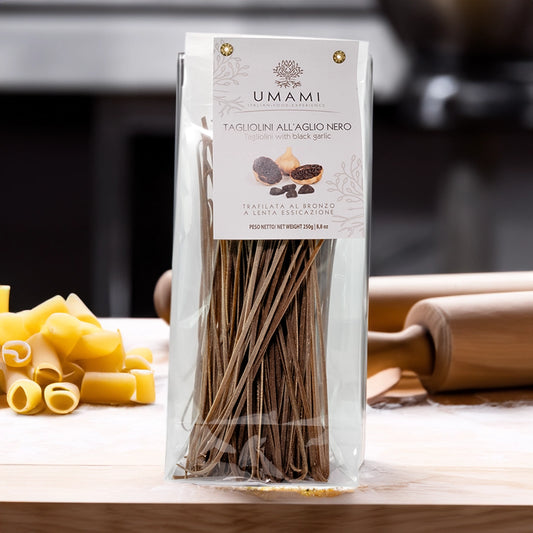 See through packet of pasta on a wooden table, surrounded by pasta and rolling pins