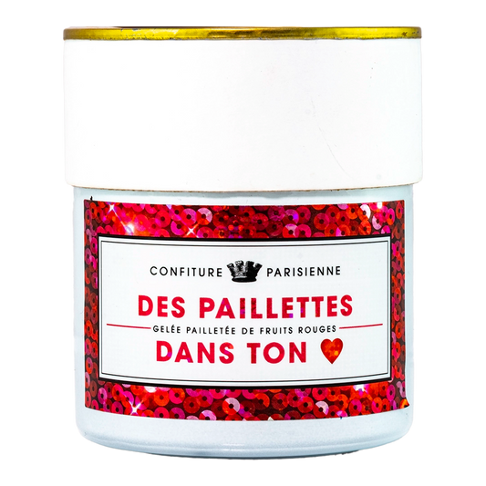 A jar of Confiture Parisienne red fruit jam with gold flakes. The label reads "Confiturier de France" and includes the product name in French.