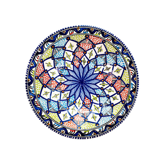 An Extra Large Moroccan style ceramic bowl with intricate Moroccan starburst patterns in vibrant colors of blue, green, red, and white