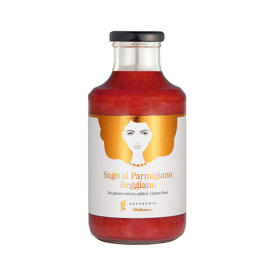 A glass bottle with Good Hair Day Tomato and Parmigiano Reggiano Sauce inside. On the white label there is an image of a women with golden hair and the writing Sugo al Parmigiano Reggiano